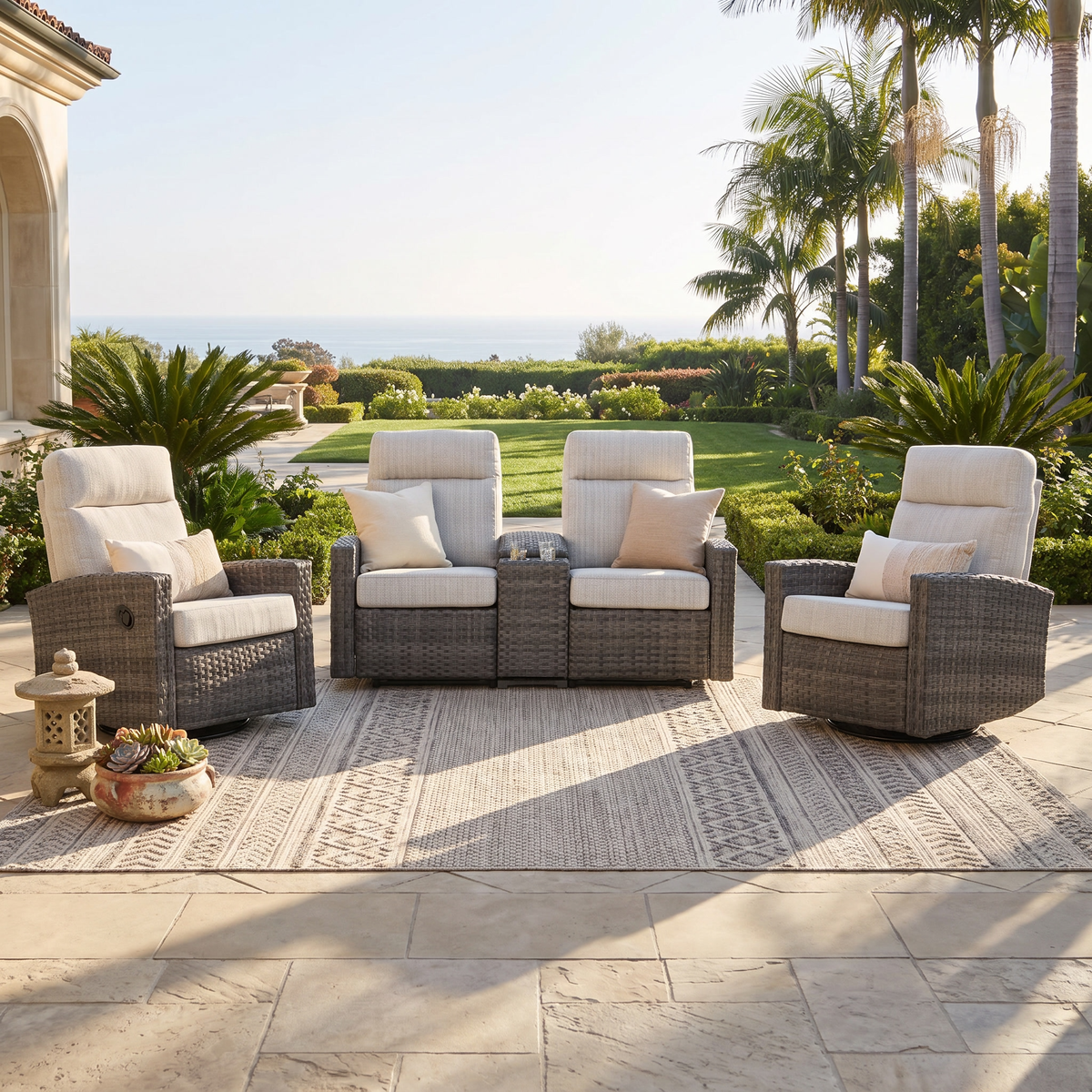 Malibu II reclining loveseat conversation set with a pair of recliners on a sunny terrace