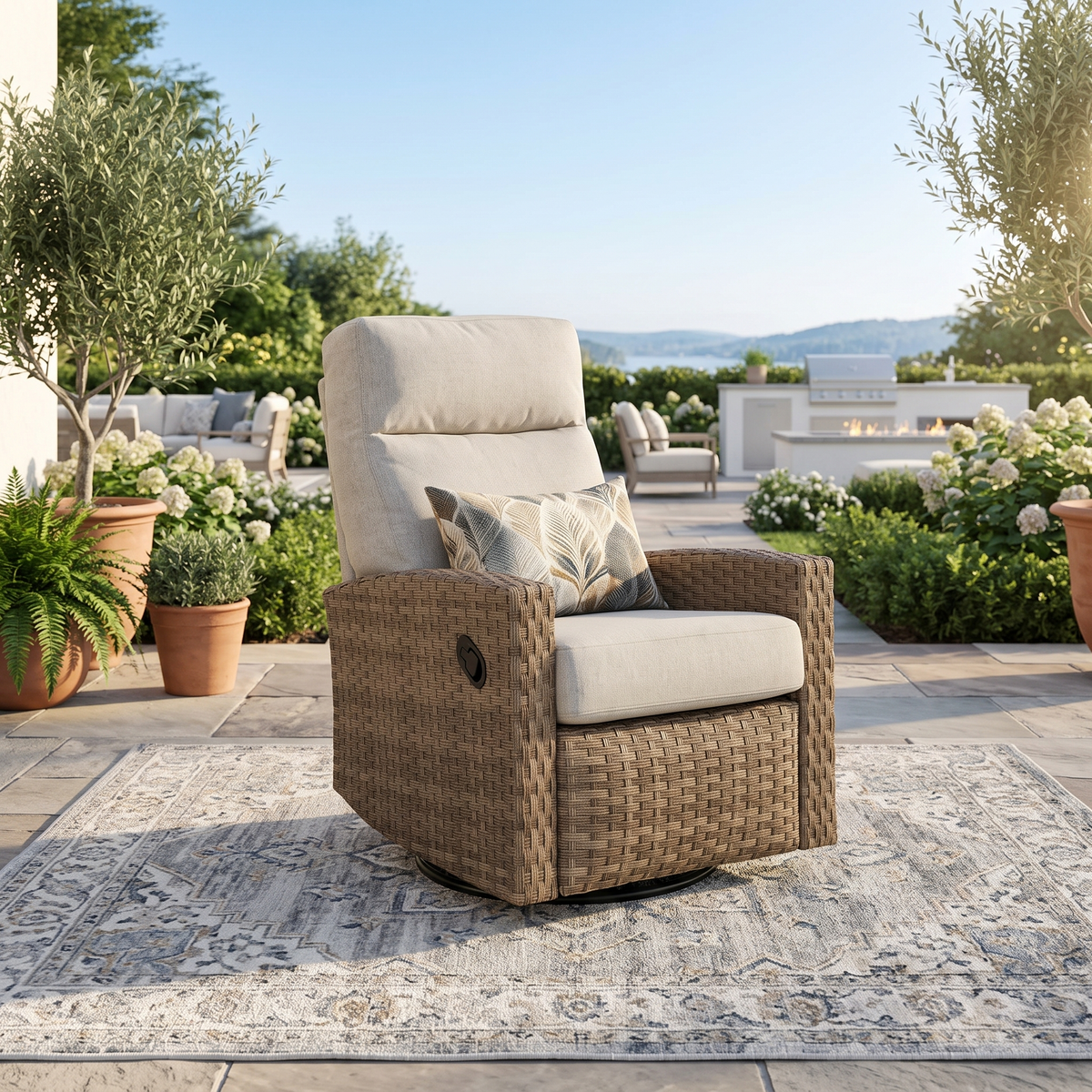 Newport swivel glider recliner in a quiet corner beside potted olive trees