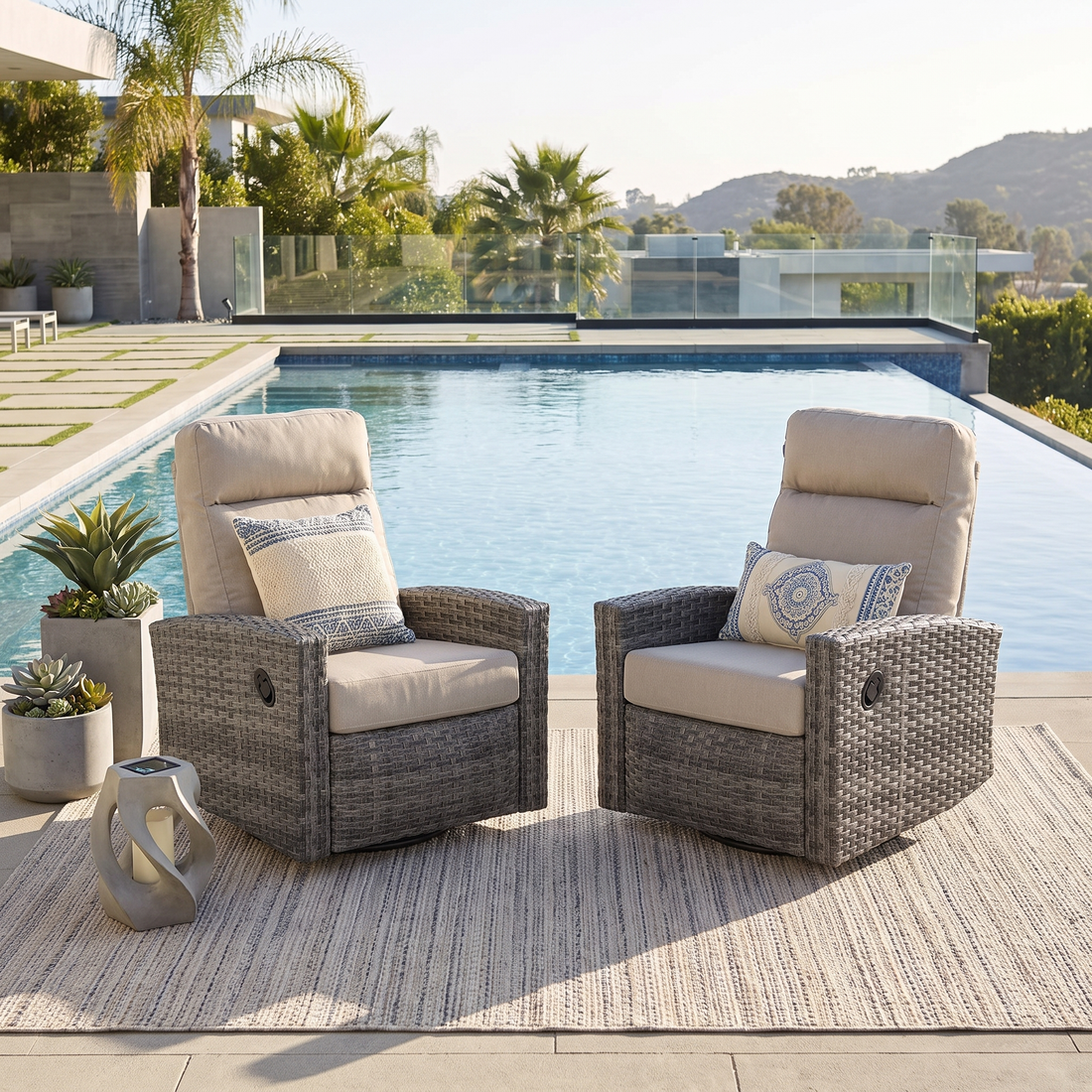 Pair of Malibu II wicker swivel glider recliners in Sunbrella Canvas Taupe outdoors